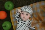 Reborn-dukken Ashley, en realistisk silikonebabydukke med detaljerede funktioner, perfekt til samlere.