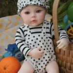 Realistic Ashley silicone reborn doll with detailed features and soft touch, perfect for collectors.
