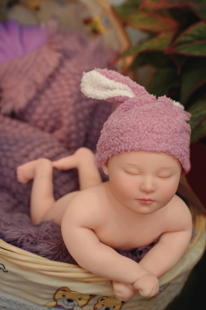 Realistic silicone reborn baby doll with soft skin and detailed features for collectors and enthusia.