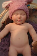 Realistic silicone reborn doll with lifelike features and soft skin. Perfect for collectors and doll.