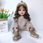 Reborn doll with realistic features, soft vinyl body, and detailed craftsmanship, perfect for collec.