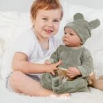 Reborn baby doll with open eyes, 18-inch soft vinyl, realistic features, perfect for collectors and.