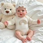 Realistic Kelly silicone reborn doll with soft plush teddy bear, perfect for creative gift collector.