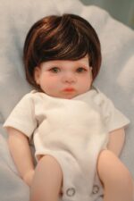 Reborn silicone doll with lifelike features, detailed hair, and soft skin for collectors and childre.