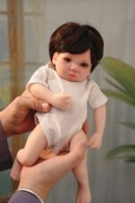 Realistic silicone reborn doll for collectors and children, lifelike features and soft touch.