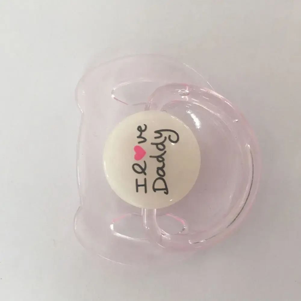 Chupete para muñeca reborn con el mensaje "Amo a mi papá" y un corazón rosa.