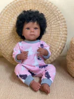 Dark skin baby doll with curly hair, realistic features, perfect for children’s birthday gifts.
