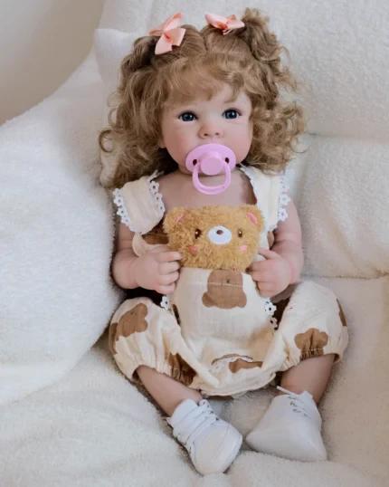 Reborn baby doll with lifelike features, rooted hair, and cuddly soft body, perfect for collectors a.
