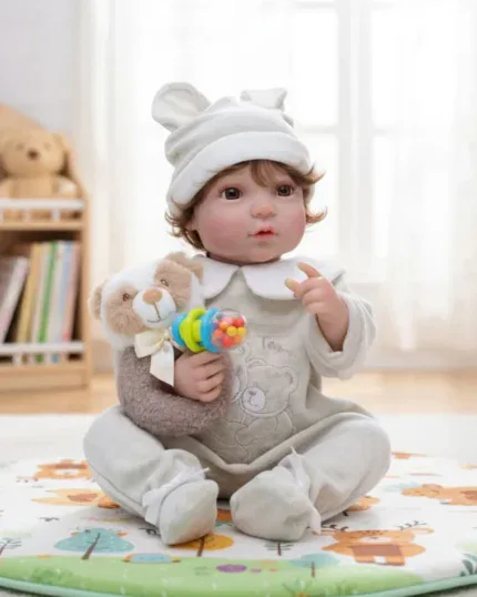 Reborn baby doll with lifelike features, dressed in cozy outfit, holding a plush teddy bear, in a br.