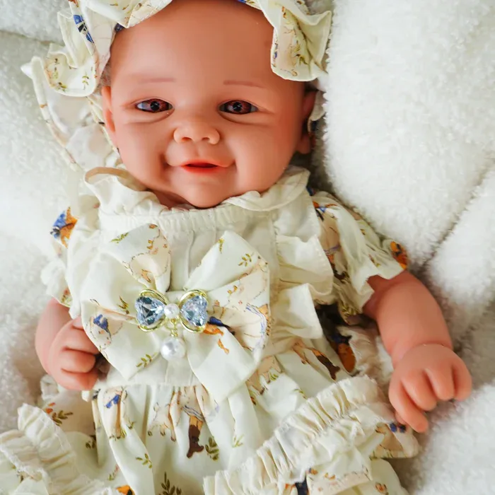 Reborn baby doll with realistic features wearing a detailed floral dress and matching headband, perf.