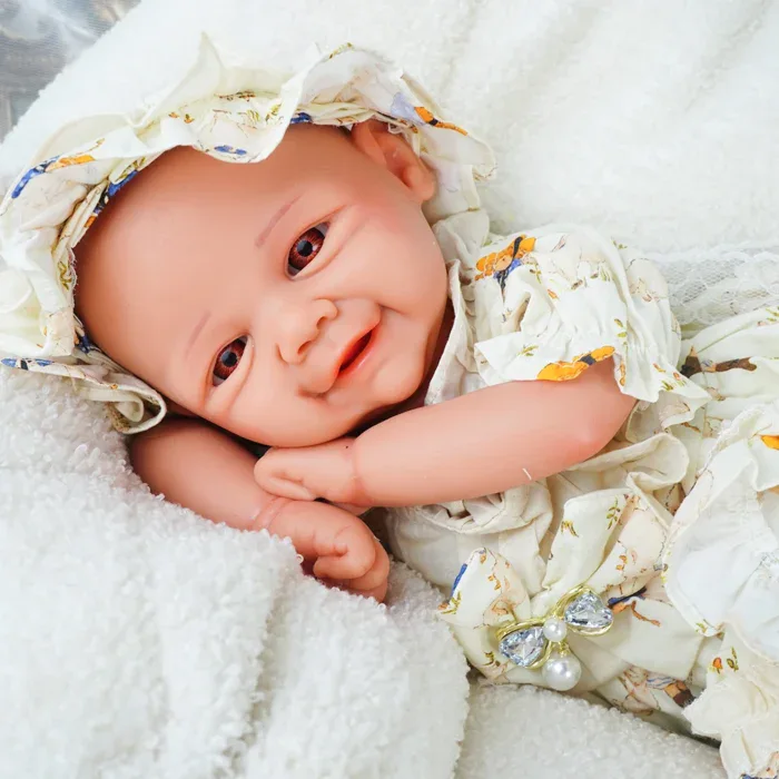 Realistic baby reborn doll with detailed features in floral clothing for collectors and enthusiasts.