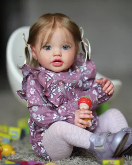 Adorable toddler girl with blue eyes and light brown hair playing with toys.
