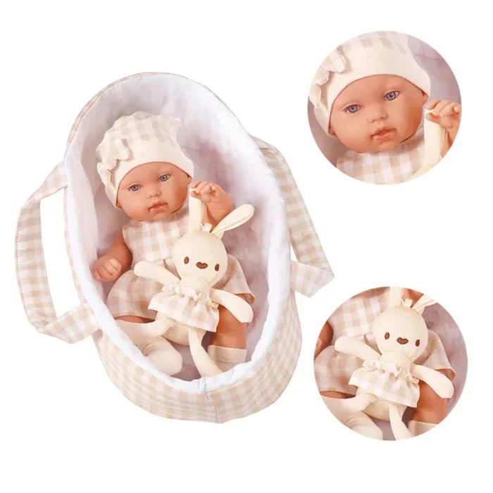 Adorable 14-inch baby girl reborn doll with bunny plush toy and matching outfit.