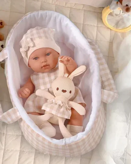 Adorable 14-inch basket reborn doll with blue eyes and soft clothing.