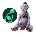 Reborn girl doll with elf ears and leopard print outfit, 20 inch vinyl baby.