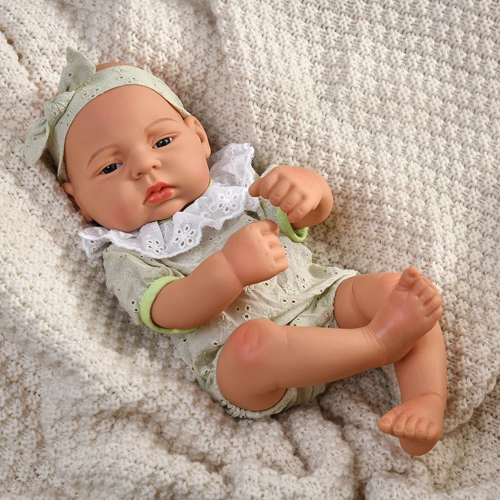 16 Inch Reborn Clothes Sweater Jumpsuit and Pinafore Set 72 Reborn baby doll wearing a green sweater jumpsuit and matching headband.