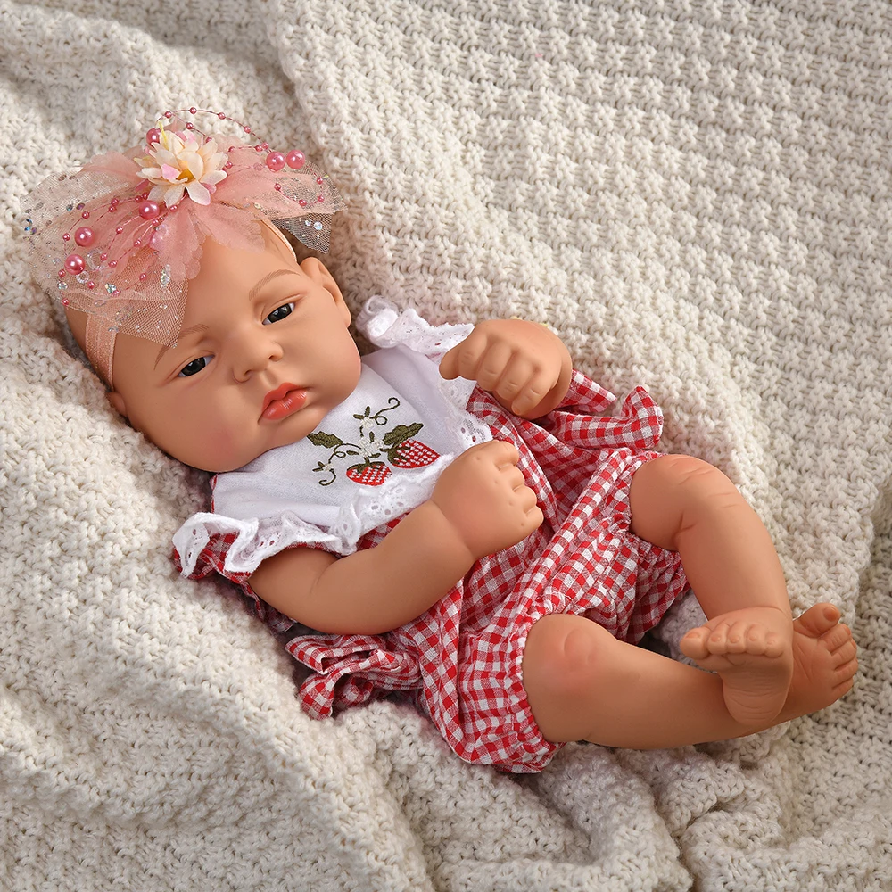 16 Inch Reborn Clothes Sweater Jumpsuit and Pinafore Set 78 Reborn baby doll wearing a red and white checkered outfit with a pink bow headband.