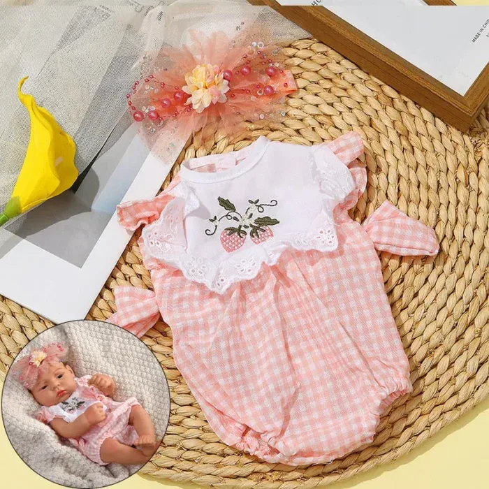 Adorable pink gingham reborn baby clothes with lace and embroidery details.
