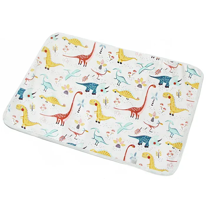 Colorful dinosaur print padded doll changing mat for play and comfort.