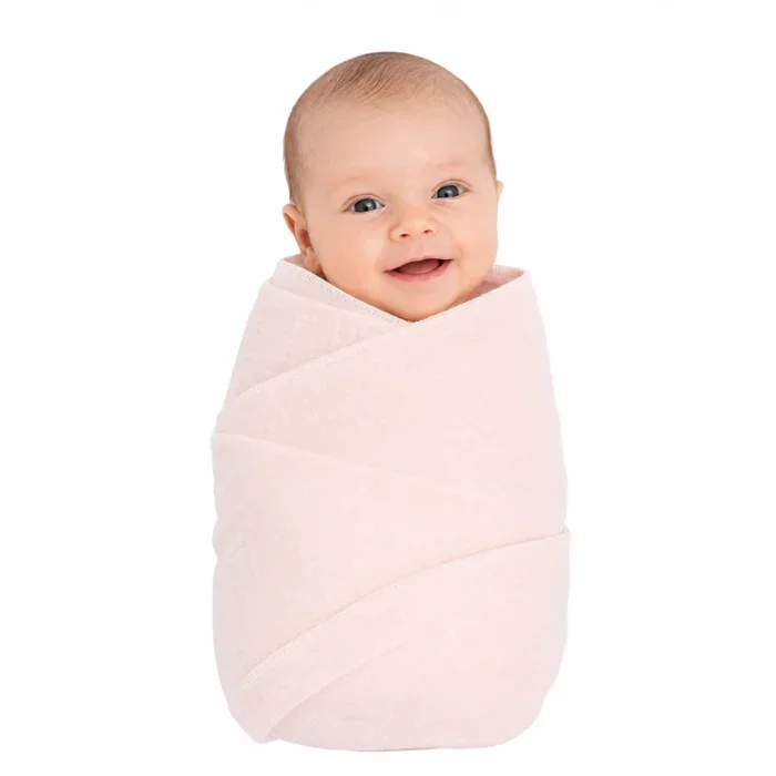 Adorable baby wrapped in a soft, plain cotton gauze blanket for comfort and warmth.