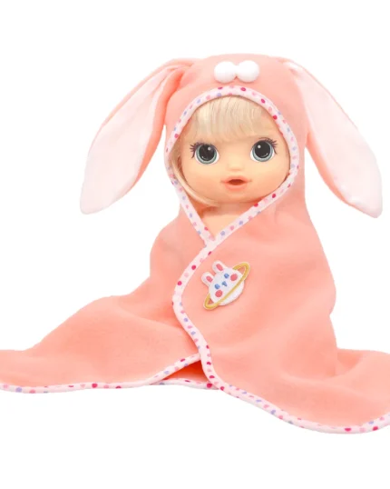 Baby doll in pink bunny hooded blanket with cute bunny face and ears.
