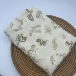 Soft muslin baby blanket with bunny and floral designs for newborns.