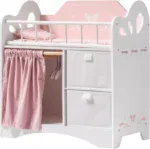 Pink and white wooden doll crib with storage drawers and bedding for 20 inch dolls.