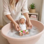 Reborn baby doll in a crocheted outfit bath time scene.